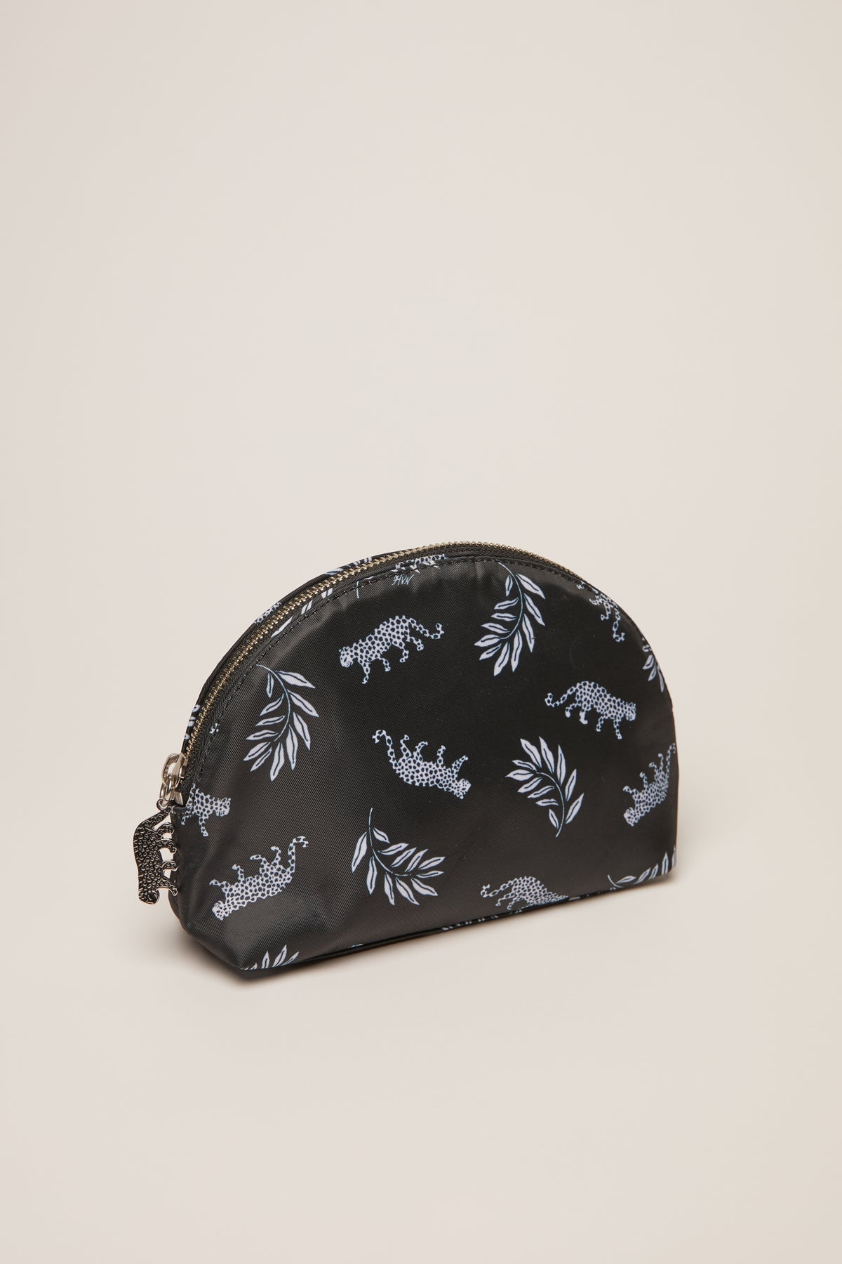 A leopard print cosmetic case with a leopard zip pull.