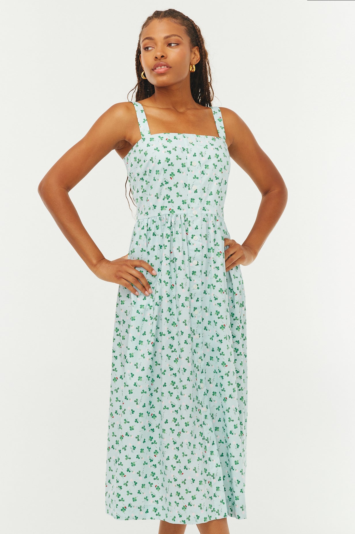 Woman wearing a floral dress on a white background