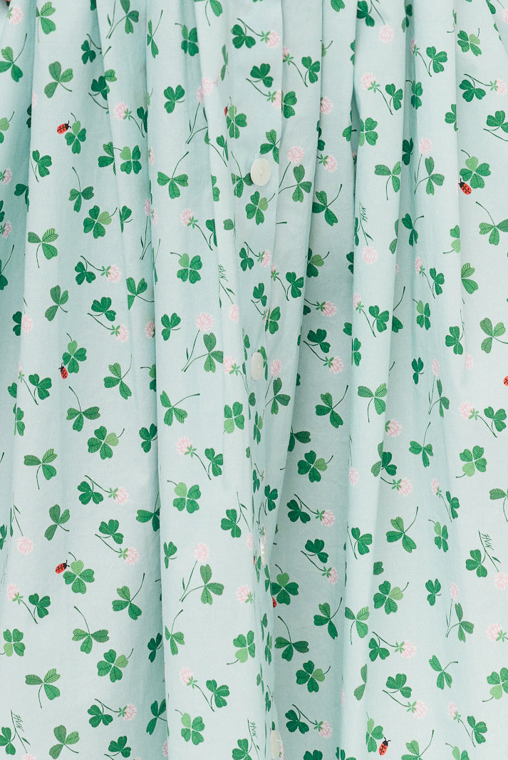Light blue fabric with green leaf pattern