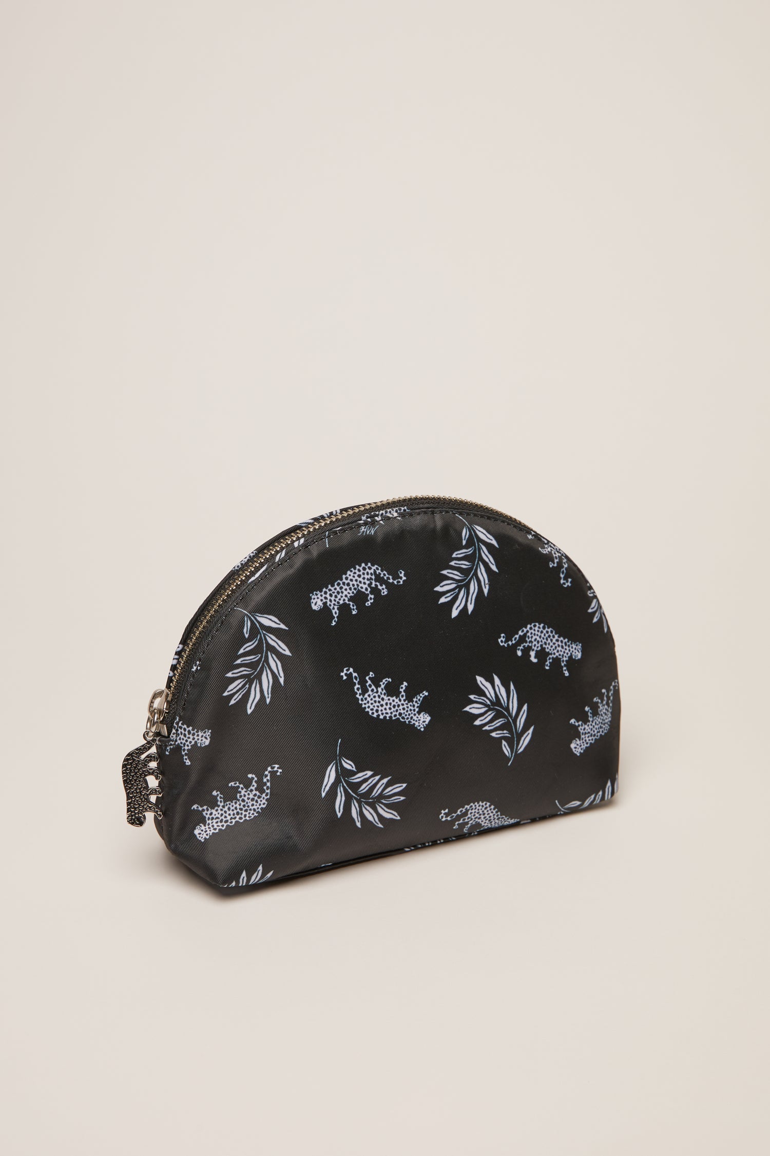 A leopard print cosmetic case with a leopard zip pull.