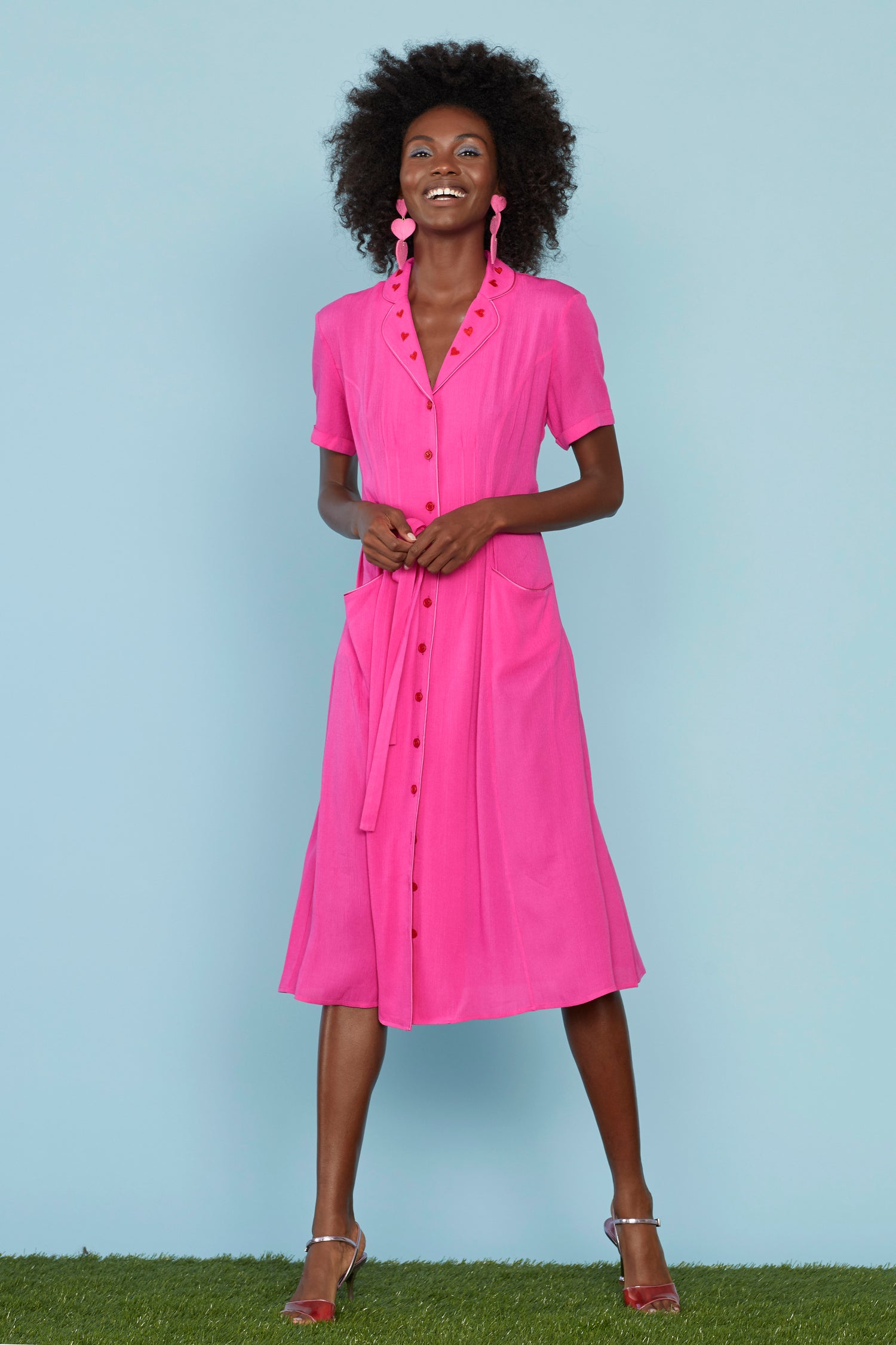 A model wears the Pink Heart Embroidery Maria Dress