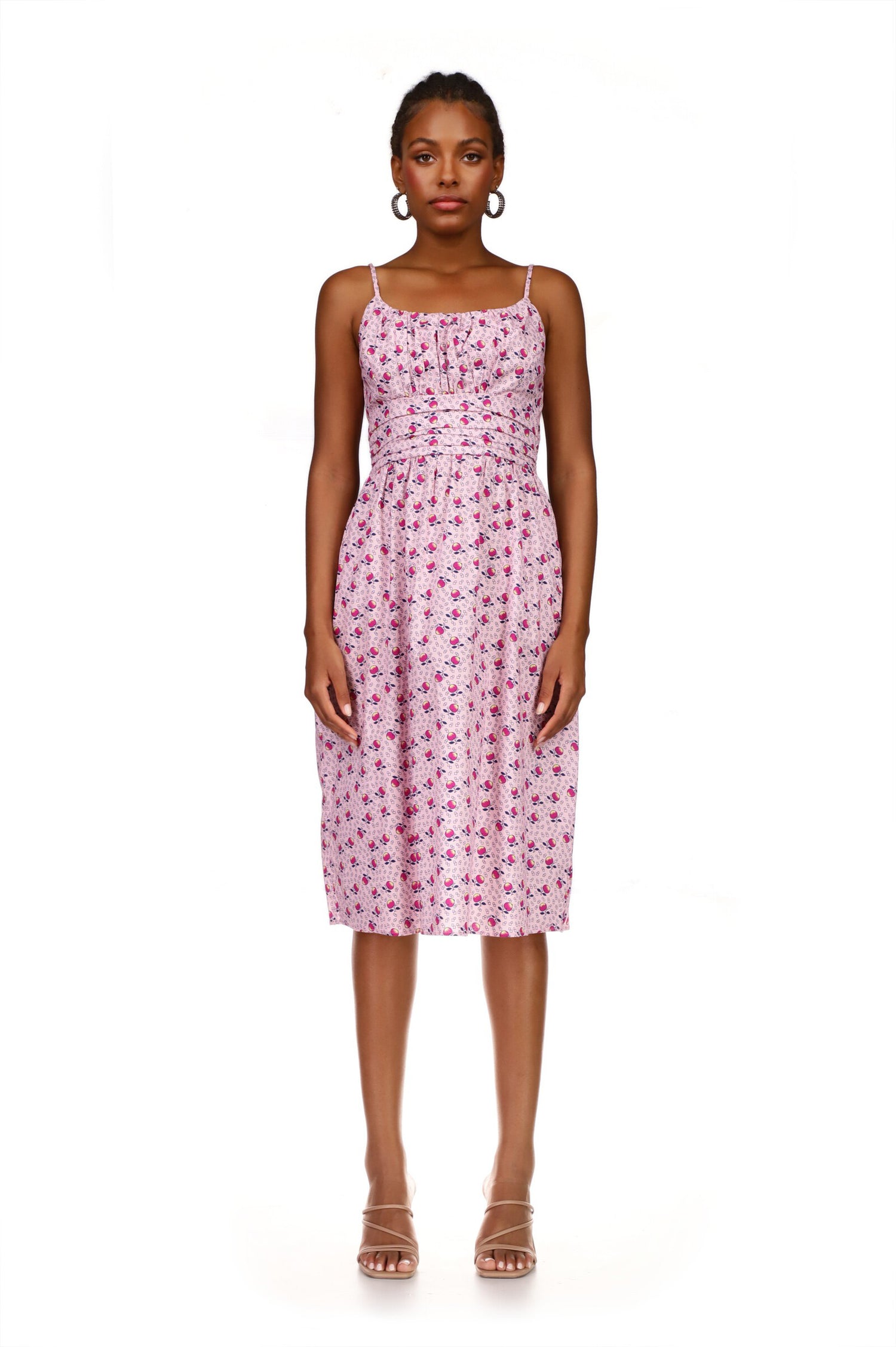 A model wears the Lucy Strappy Cotton Ruched Dress